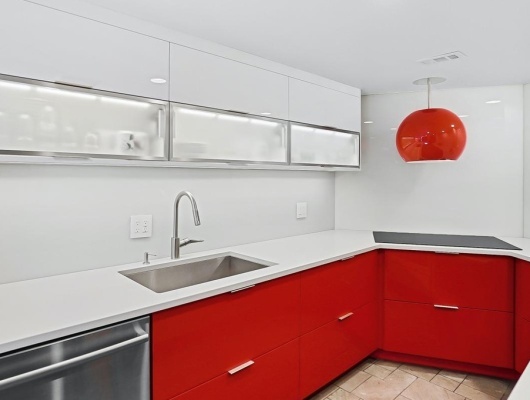 Custom painted red gloss cabinetry