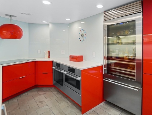 Custom painted red gloss cabinetry